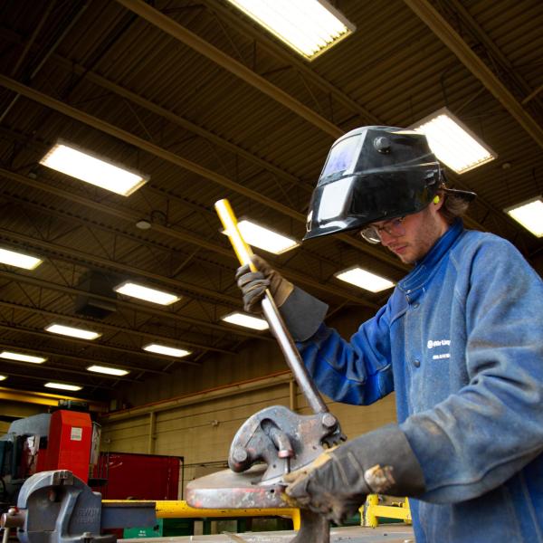 A welding student learning part of the process.