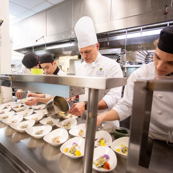 students cooking in VIUs professional kitchen