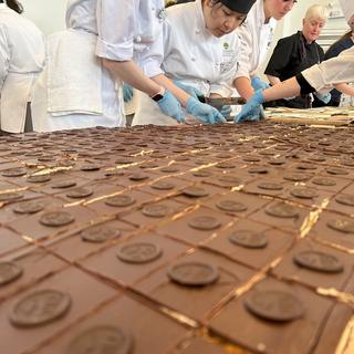 Students prepare pieces of the world's largest Nanaimo bar