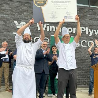 The chairs of VIU's baking and culinary programs celebrate and hold official world record certificate the 